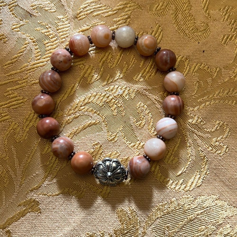 Handcrafted beaded bracelet with metal bead detail
